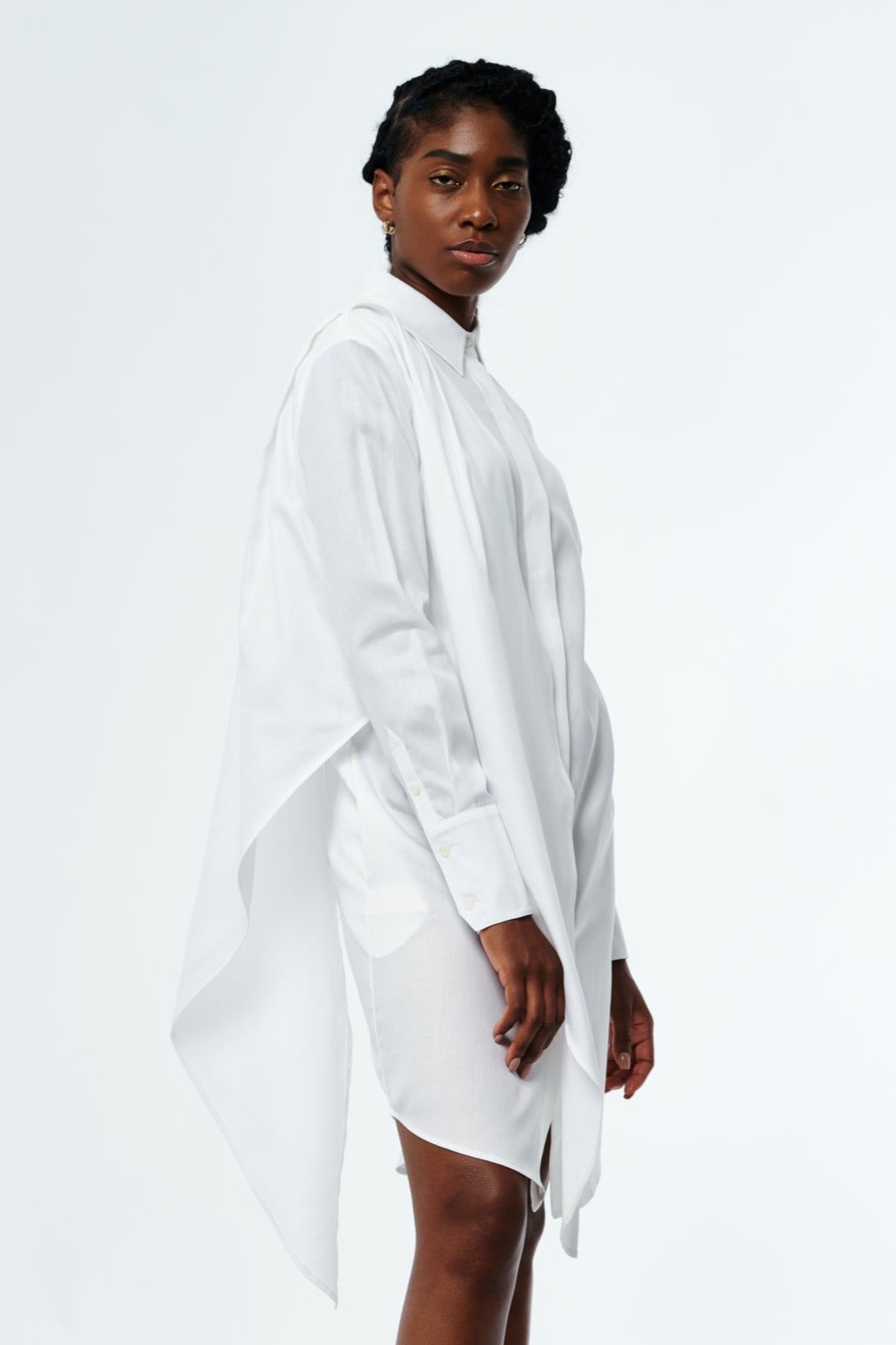 Woman wearing a white cotton shirt dress by CHABELLA walking in New York City